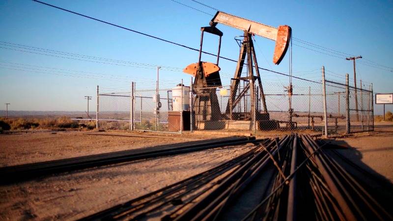 Oil trades higher on hopes of continued output cut